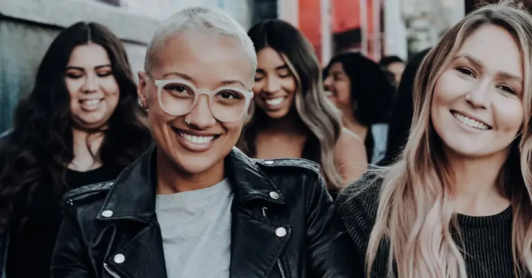 A group of girls smiling from the post Why some people struggle to make friends.